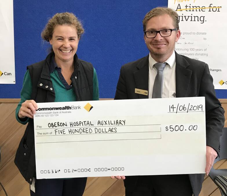 SMILE: Sarah Martin from Oberon Hospital and Brendan Gunn from Commonwealth Bank Oberon at the presentation of $500 to the Oberon Hospital Auxiliary.