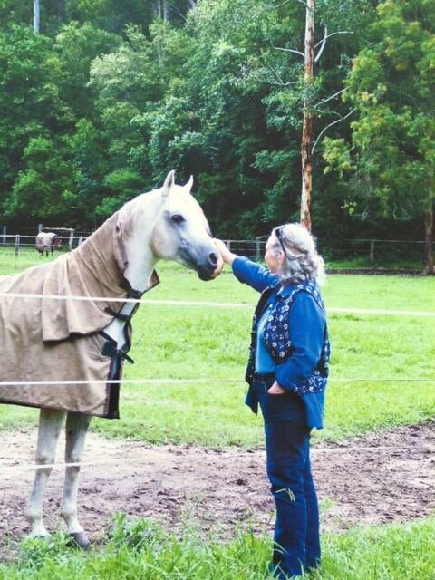 INSPIRATION: Janet Baljeu with Orlando, the horse who inspired her story The Wind Came Down The Chimney.