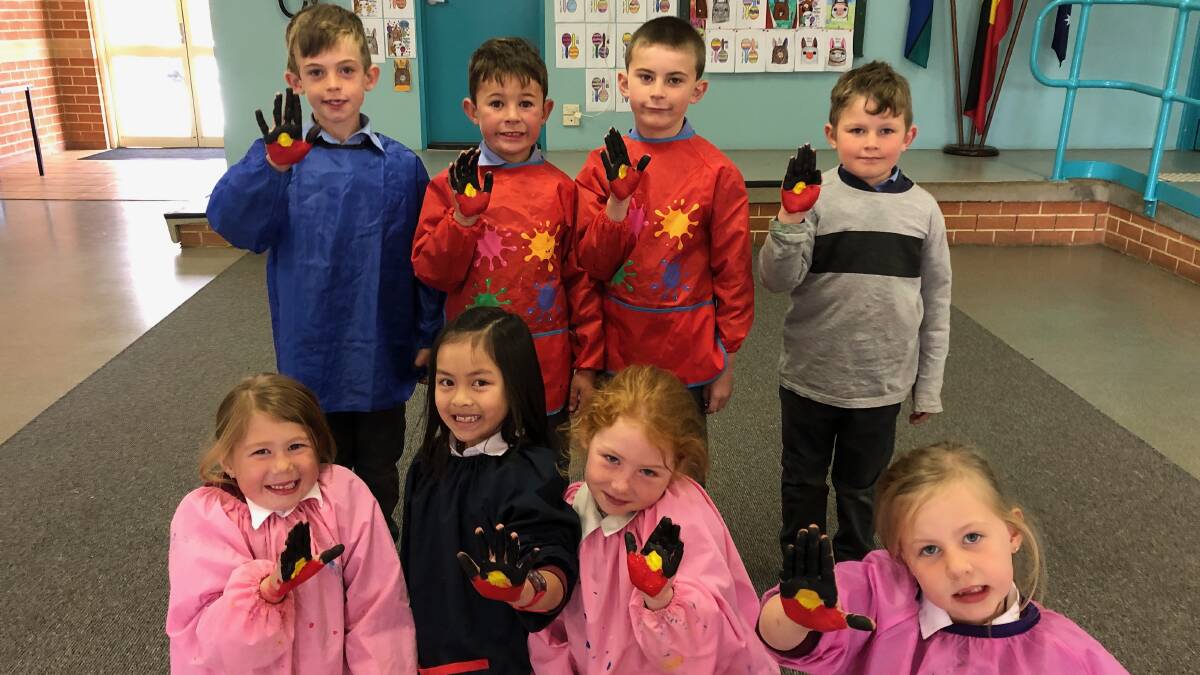 FLAG: St Joseph's year one students Harrison Pointon, Bentley Armstrong, Max Behan, Jack Kilby, Gracie Lewis, Arrina Yee, Rose Christie-Johnston and Aurora McCarthy.