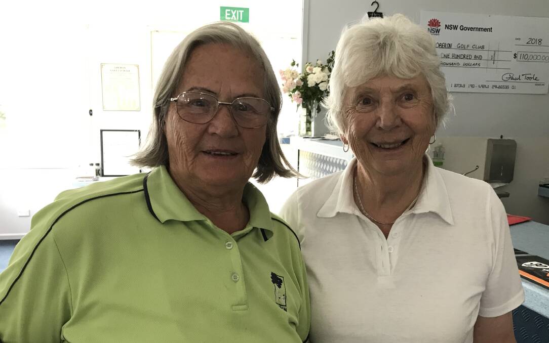 HAPPY: Runner-up Barbara Coleman with women's golf winner, Joan Graham. A countback decided the result.