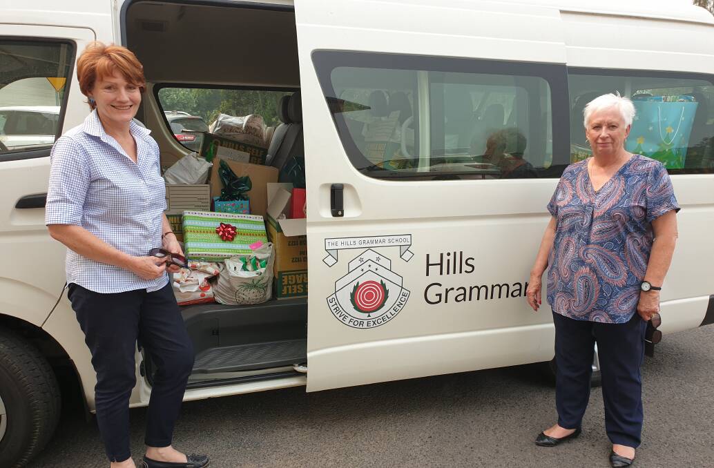 GENEROUS: Hills Grammar School's Liz Pellinkhof with mayor Kathy Sajowitz and the busload of presents from Hills Grammar.