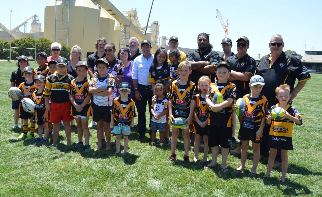 BOOST: Member for Bathurst Paul Toole with Oberon Tigers club members after the announcement of a scoreboard upgrade.