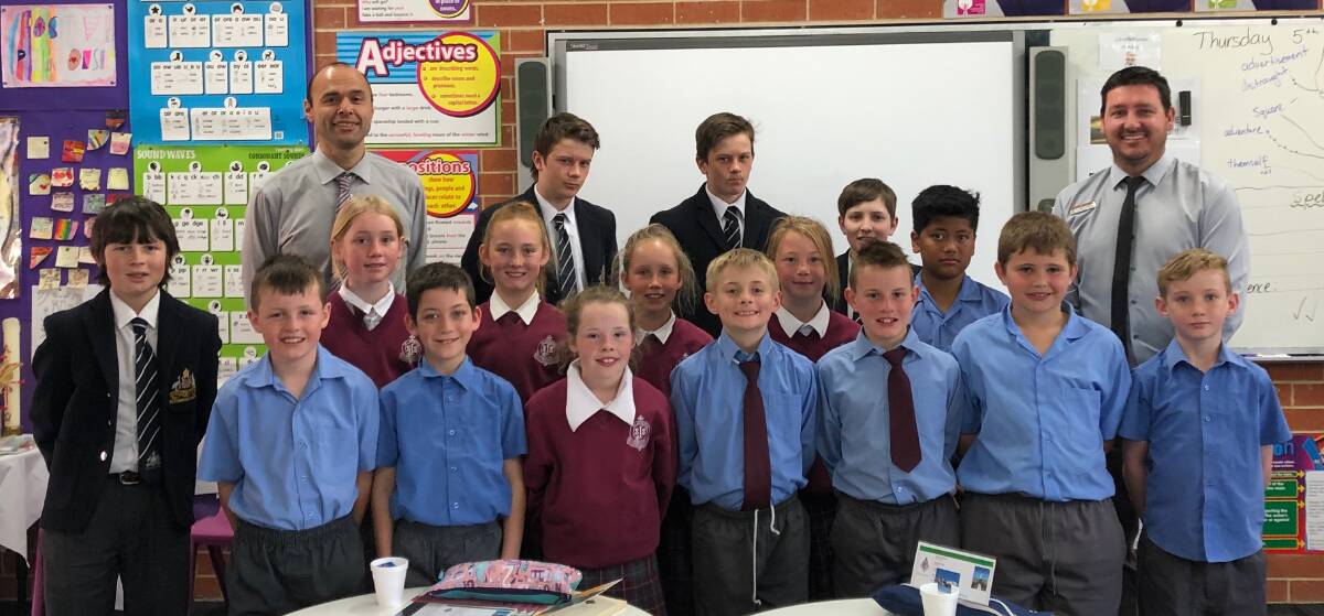 HAPPY: Former St Joseph's School students conducted a mission workshop for year four students when they visited the school recently.