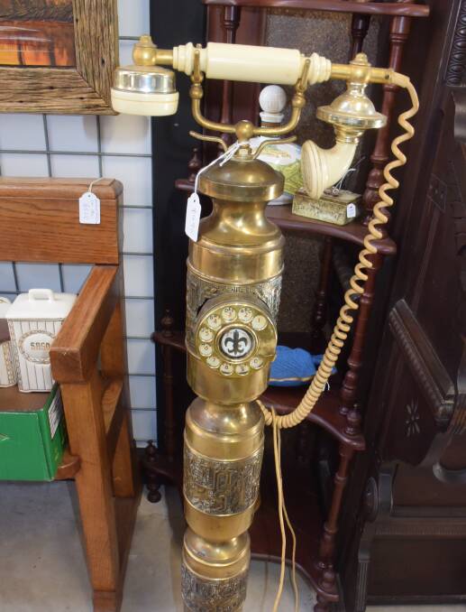 SPECIAL: A 1900s telephone stand is one of the unusual pieces for sale at Hazelgrove Cottage.