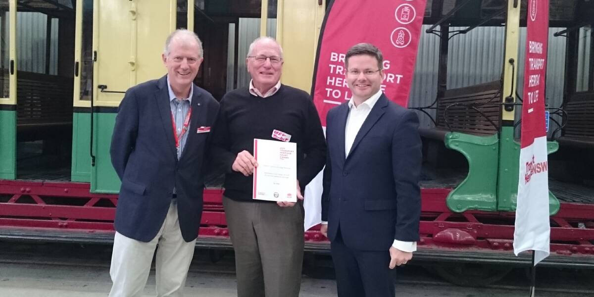 GRANT: Transport Heritage NSW director Howard Collins, OTHR president Greg Bourne and parliamentary secretary for transport Mark Coure at the Sydney Tram Museum.