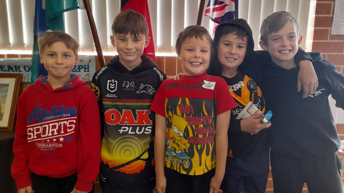 IN THE SPIRIT: St Joseph's students Jack, Max, Trevor, Bentley and Harry dressed in NAIDOC Week colours.