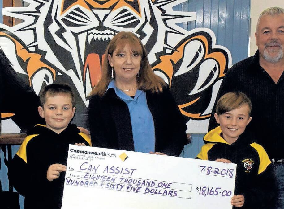 SUPPORT: The Oberon Tigers' Can Assist charity auction will be held this Sunday after being postponed due to the snow. Pictured is the cheque presentation from last year.