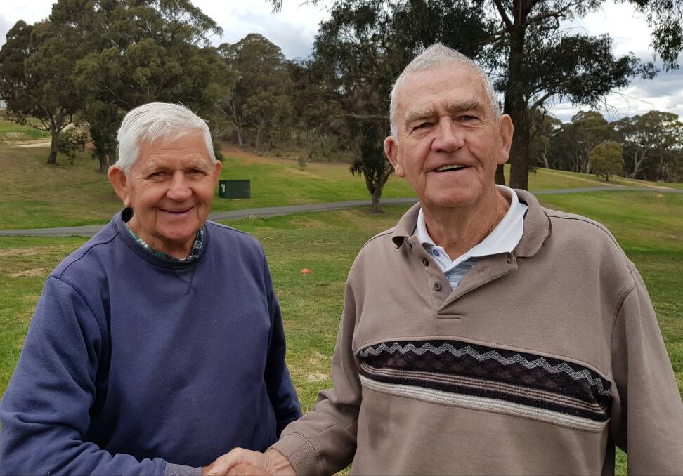 MATES: Barry Stubbs congratulates Doug Collins for a great round of 42 points to easily win the great Aussie Lamb challenge at Oberon Golf Club.