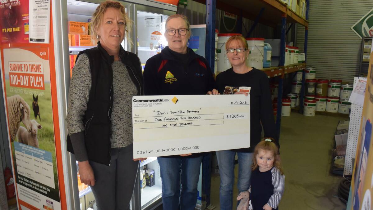 HELPING HAND: Vicki Walsh, Ros Hammond, Haley Whittaker and Quinny with a donation to help local farmers.