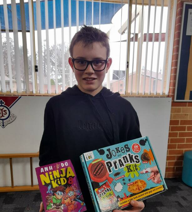 MY WORD: St Joseph's student Archie Karadimas with his Book Fair purchase.