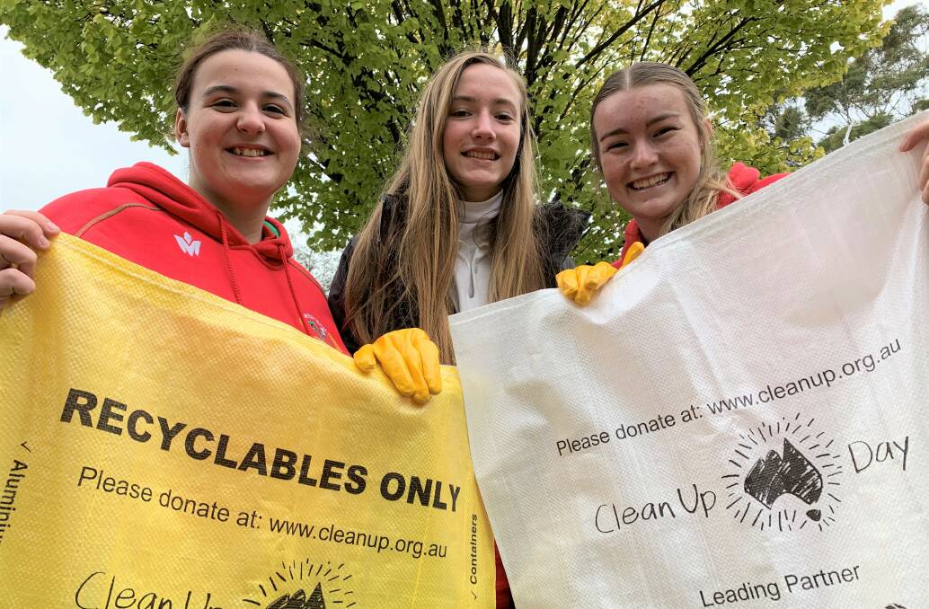 HELPFUL: Oberon High School students Zoe Gibbons, Jessie Blinco and Peta McGrath joined other students in Clean Up Australia Day at the school.