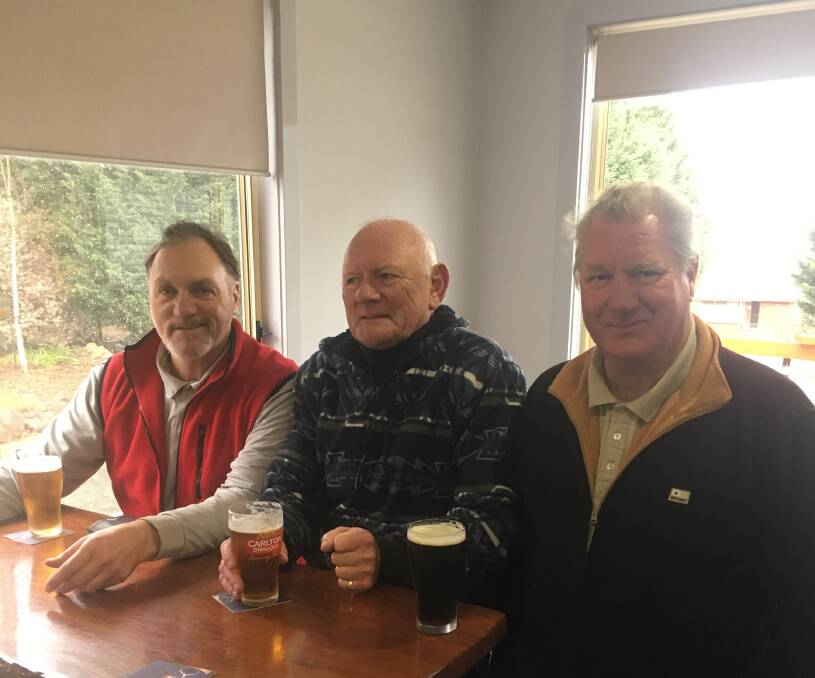 KEEN: Alan Cairney, Peter Stewart and Bill Edwards played 18 holes in cold and snowy conditions on Saturday.
