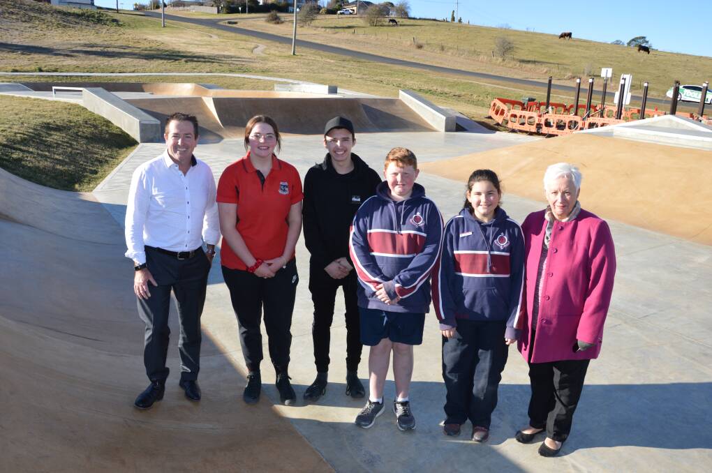 Ready for action: Member for Bathurst Paul Toole along with Rebecca Stewart, Baily Nielsen, James Stewart, Alicia Gaiser and mayor Kathy Sajowitz at the new Oberon Skate Park and Youth Precinct. Photo: File.