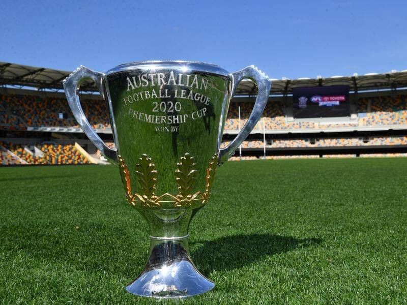 The AFL Premiership Cup will be presented to Richmond or Geelong at the Gabbaon Saturday.