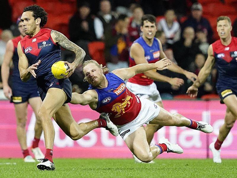 Melbourne's Harley Bennell (l) has announced his retirement from the AFL on social media.