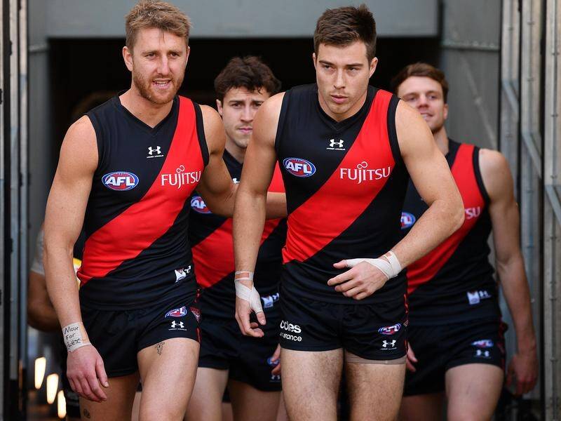 Essendon captain Dyson Heppell (L) hopes COVID disruptions will be minimal at the Bombers in 2022.