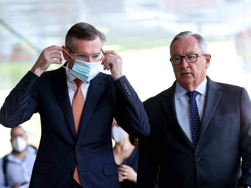 Premier Dominic Perrottet says the NSW health system is tracking better than the best case scenario.