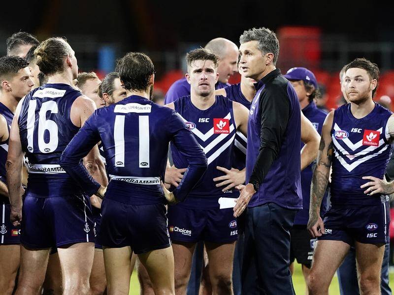 Coach Justin Longmuir is challenging Fremantle to play more positively against top AFL teams.
