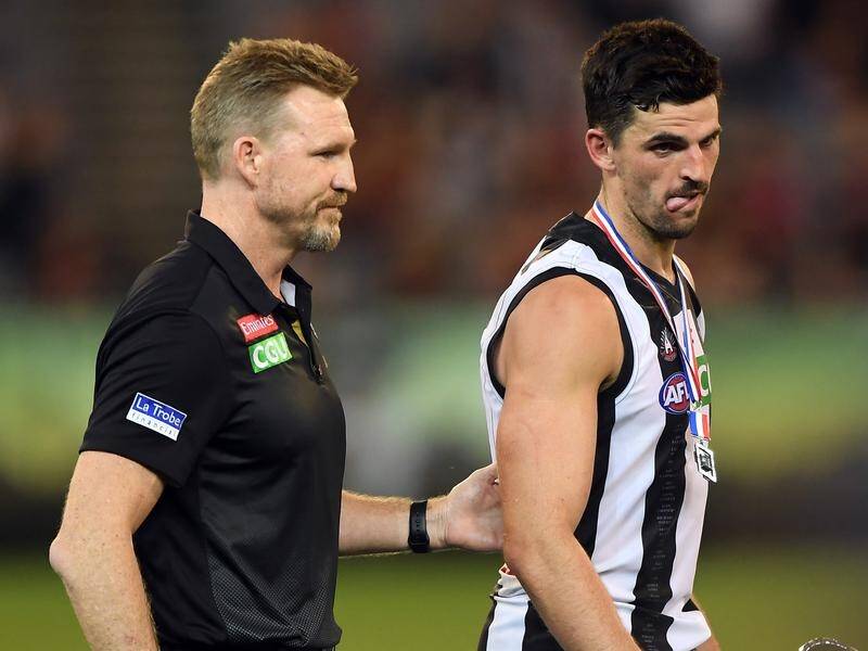 Magpies coach Nathan Buckley has criticised Essendon fans for booing his captain Scott Pendlebury.