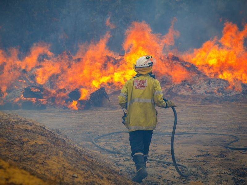 Firefighters are battling a bushfire north of Perth that continues to rage out of control.