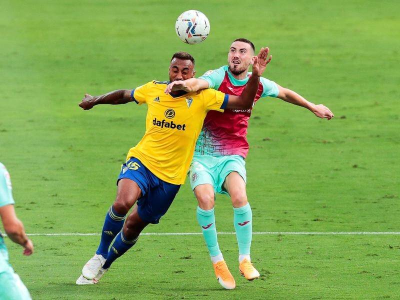 Cadiz's Carlos Akapo (L) and Villarreal's Moi Gomez battling during their controversial 0-0 draw