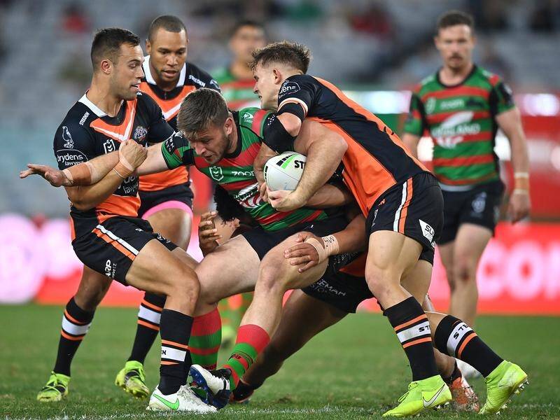 Wests Tigers hooker Jake Simpkin (r) made 55 tackles in his NRL debut against Souths.