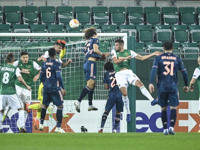 David Luiz soars to head home Arsenal's equaliser in their Europa League 2-1 win at Rapid Vienna.