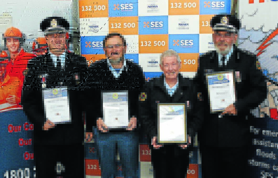 SERVICE TO THE COMMUNITY: Craig Gibbons, David Walther, Janine Sharp and Alan Sharp with their long service awards. 081215SES