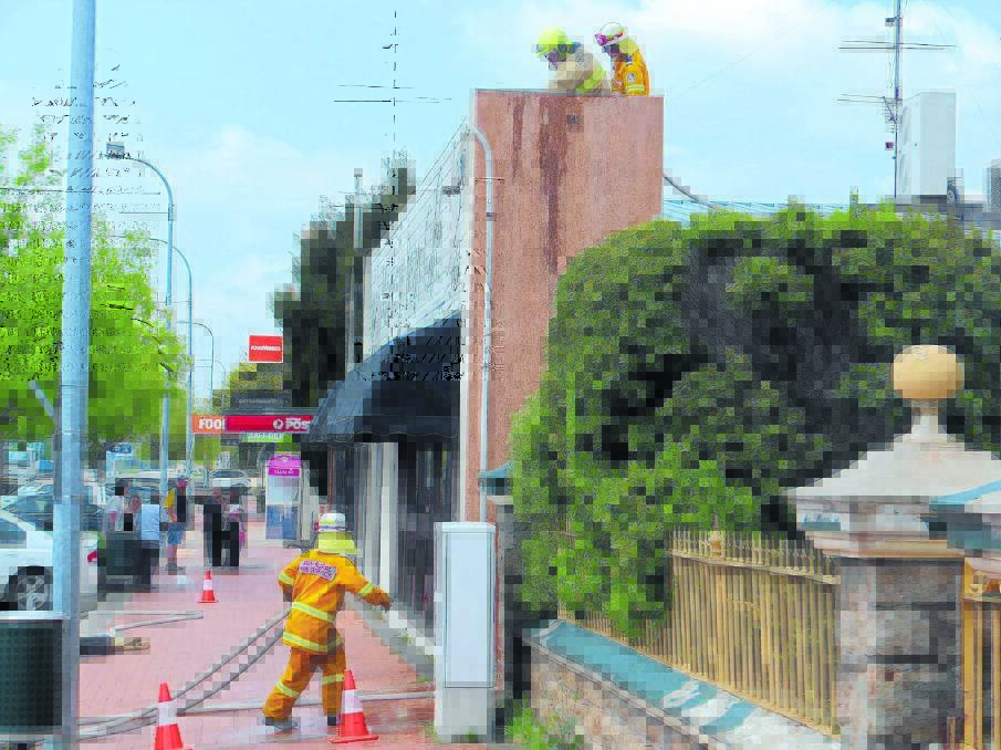 DRAMA: Firefighters at the Monkey Bean Cafe last week.