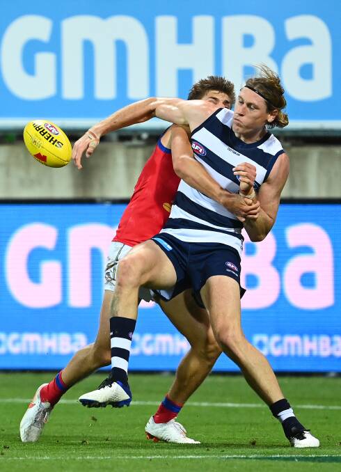ROBBED: Cat Mark Blicavs should have been penalised for holding the ball close to Brisbane's goal. Photo: Quinn Rooney/Getty Images