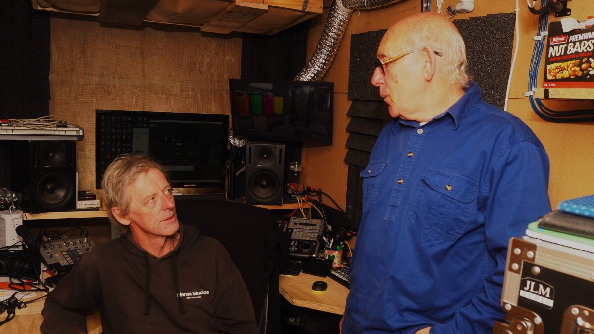 RETROSPECTIVE: Oberon-based musician Martin Raphael [right] with Bathurst audio engineer Tim Roebuck in his home studio. Photo: SAM BOLT
