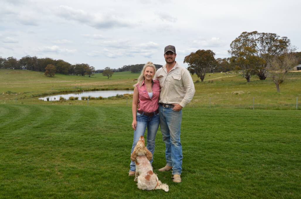 LIFE ON THE LAND: Mr and Mrs Cragg with their dog 'Cowboy' in the place they got married. Picture: ALANNA TOMAZIN