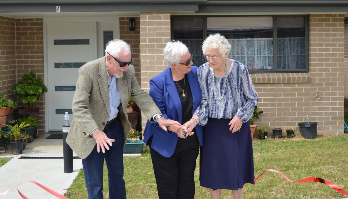 OFFICIAL OPENING: Graham Parker, outgoing mayor Kathy Sajowitz and Pat Dwyer cut the ribbon at Leath Johnston and Mervyn Dwyer Houses. Picture: ALANNA TOMAZIN