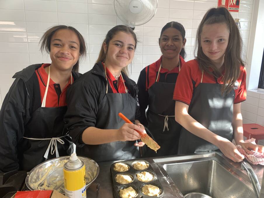 Lily Saukura, Serenity Saville, Sala Rounds and Ebony Howard bake a batch of banana muffins. Picture: Supplied 