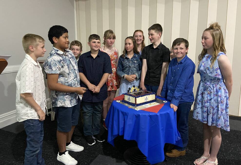 CELEBRATE: Year 6 cutting their cake. Picture: SUPPLIED
