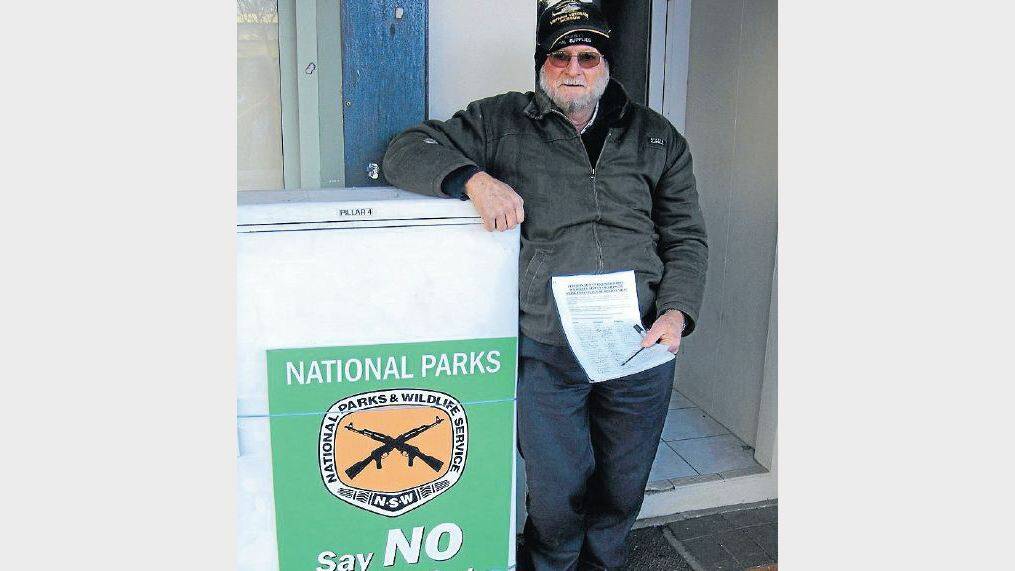 Max Sward holds a petition requesting NSW Premier Barry O’Farrell ban shooting in state forests and national parks in the Oberon area.